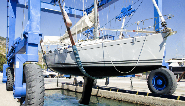 Sailing boat with mast down Sailing boat in shipping cradle with mast down