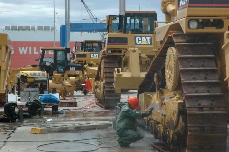 Cleaning Caterpillar mining machines at port