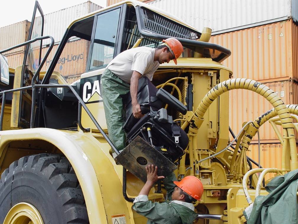 Dismantling Caterpillar machine in preparation for entry into Australia