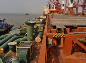 a barge loaded with a dismantled tailing thickener is anchorage alongside MPP vessel for transfer in China prior to tariffs