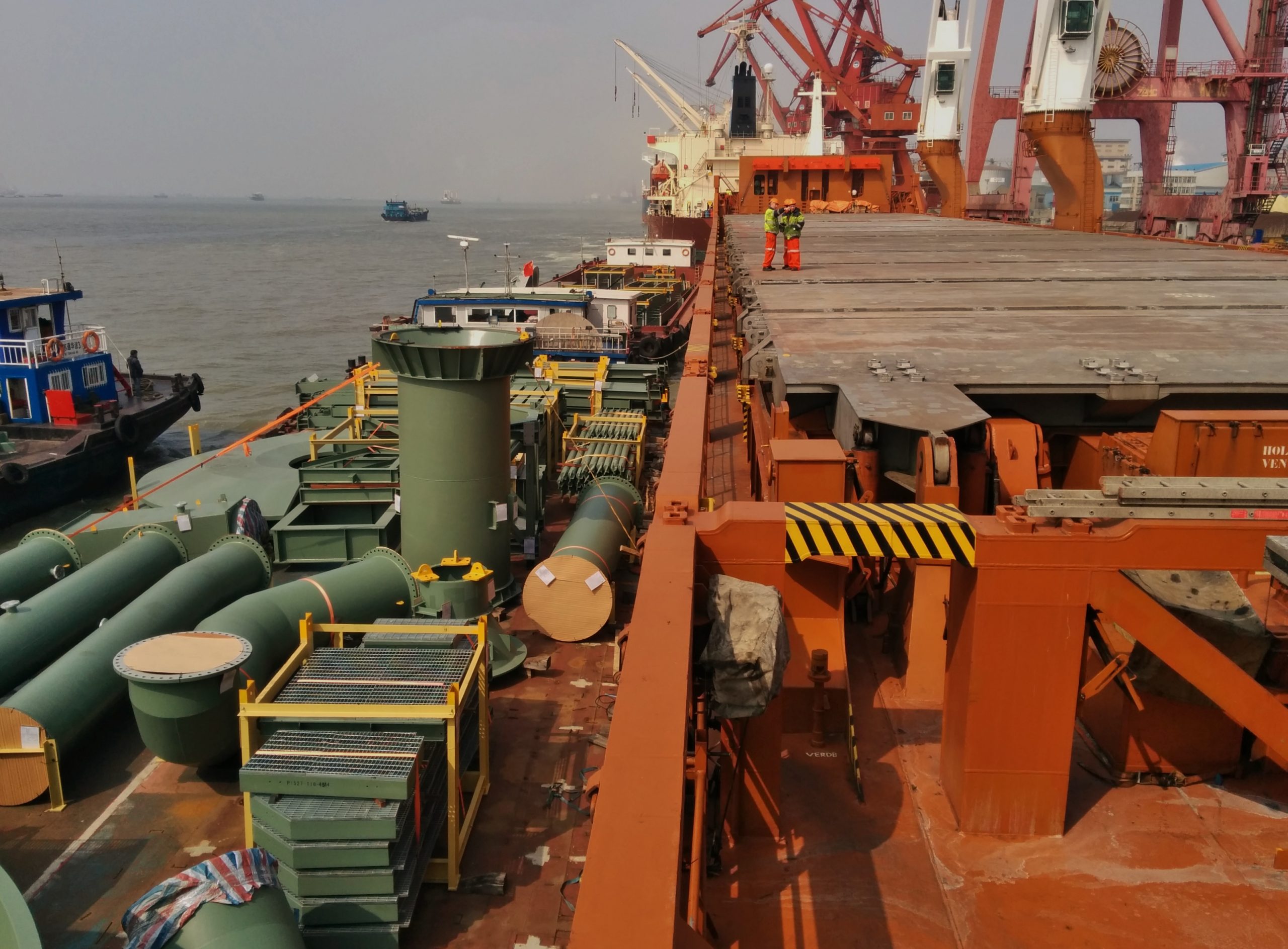 a barge loaded with a dismantled tailing thickener is anchorage alongside MPP vessel for transfer in China prior to tariffs